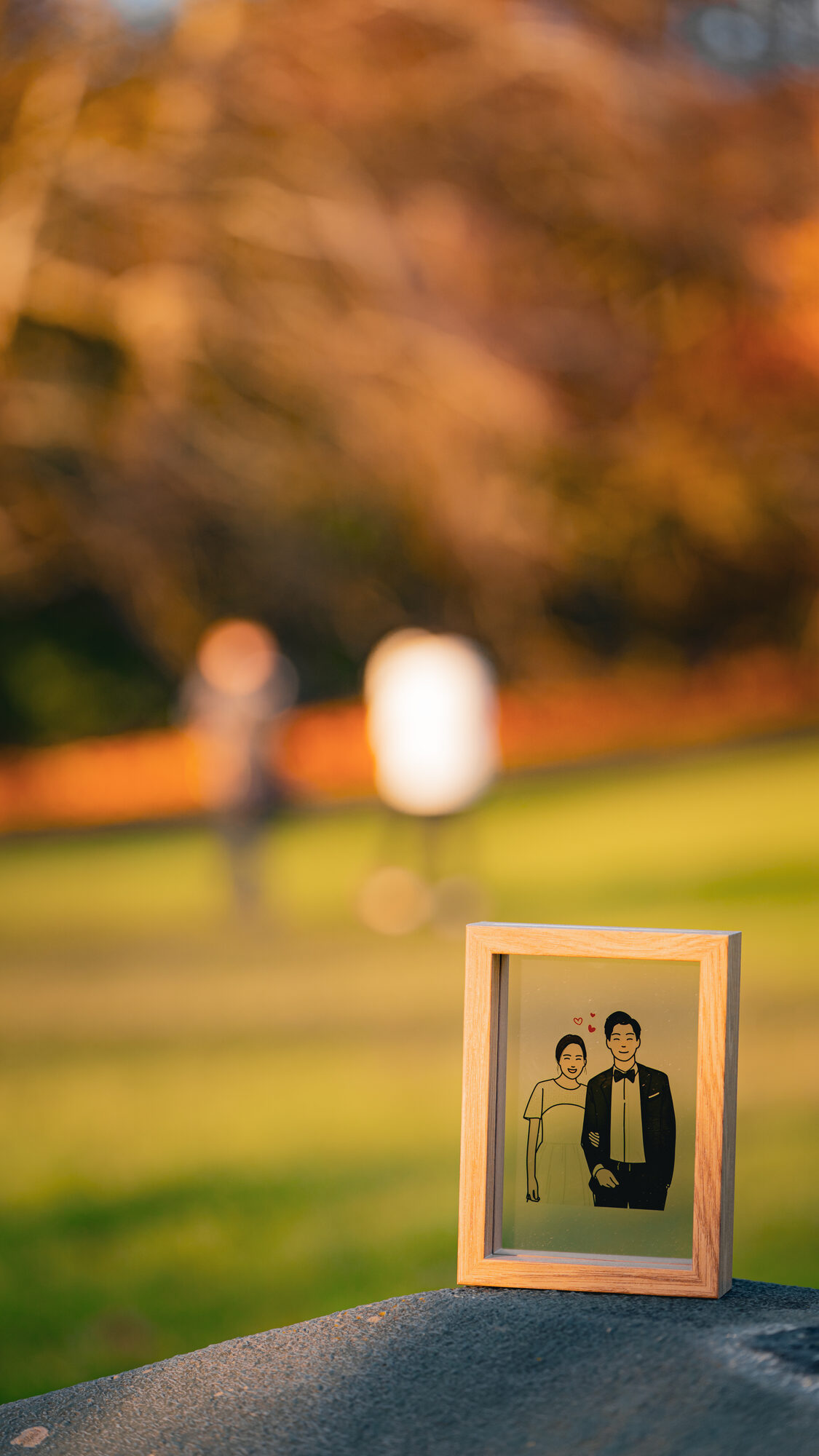 Couple posing in front of the Great Hall facade at the University of Birmingham
