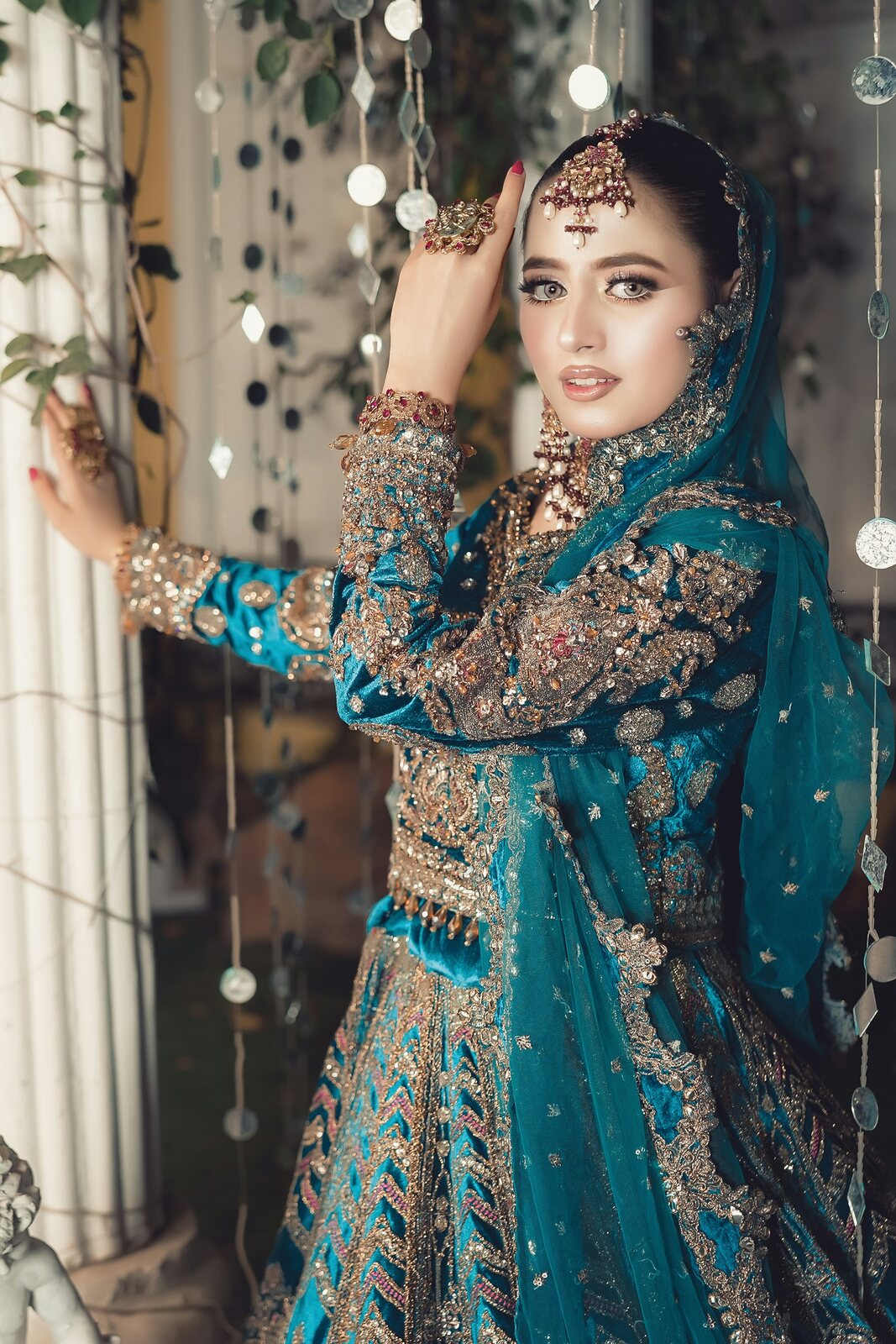 bride portrait in teal and gold bridalwear
