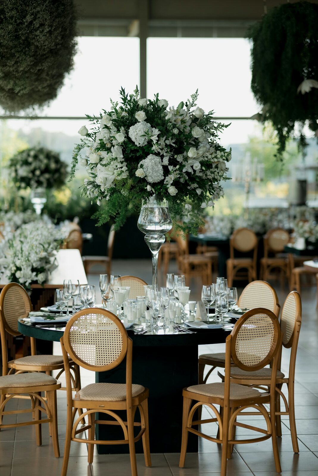 Elegant UK wedding reception top table with floral centrepiece